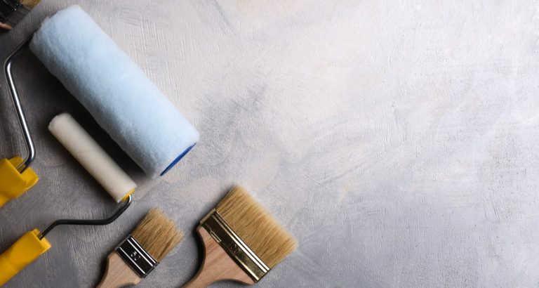 spatulas-application-putty-brushes-rollers-painting-gray-concrete-table-top-view spatulas-application-putty-brushes-rollers-painting-gray-concrete-table-top-view